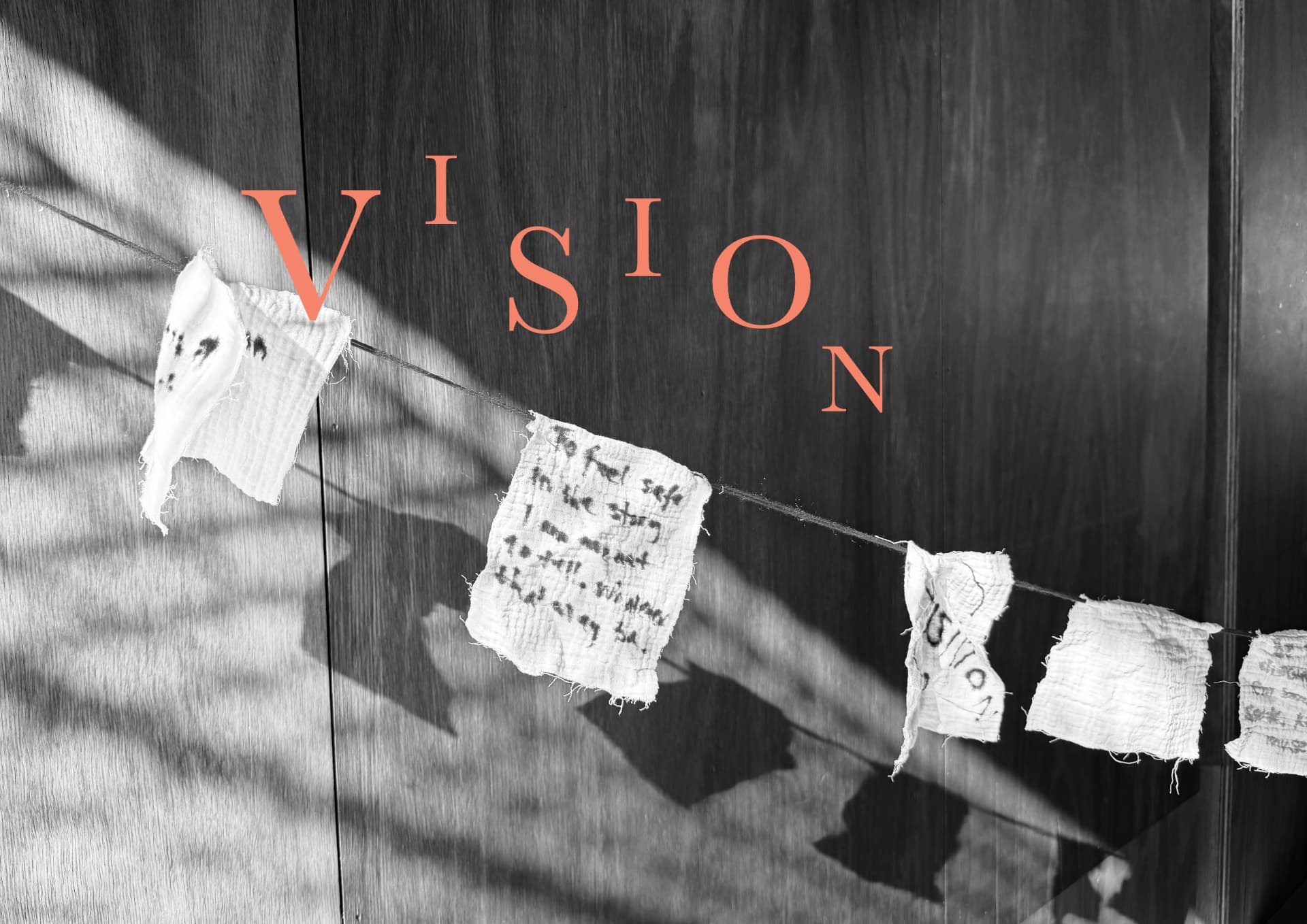 Prayer flags on a string with coral VISION lettering